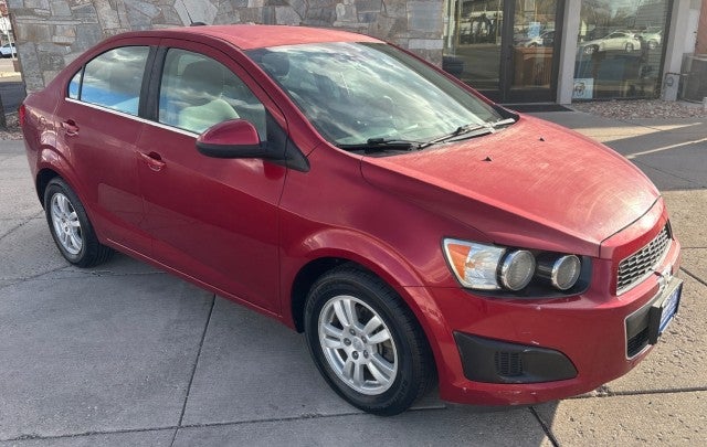 2015 Chevrolet Sonic LT in Crystal Red Tintcoat — front three-quarter view